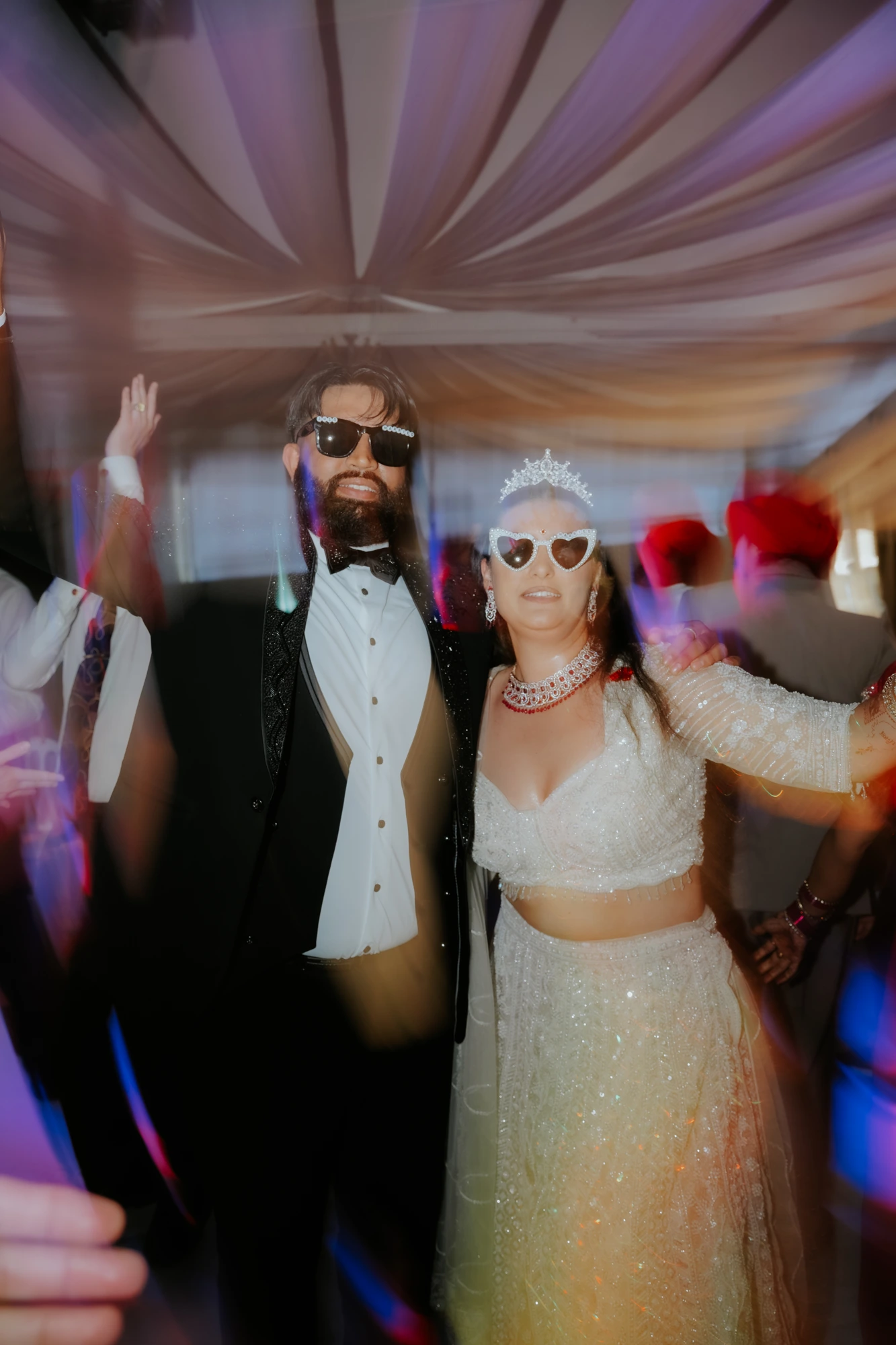Bride and groom dancing at the reception party